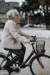 Active senior city life portrayed through a woman riding a bicycle on an overcast day, signifying vitality in later years.