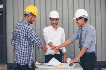 Group of multiracial people Teamwork meeting join hands Engineer Manager Foreman fist bump...
