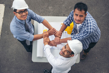 Group of multiracial people Teamwork meeting join hands Engineer Manager Foreman fist bump together. Close up diversity engineer people hands partner teams. Business connection team join partnership - obrazy, fototapety, plakaty