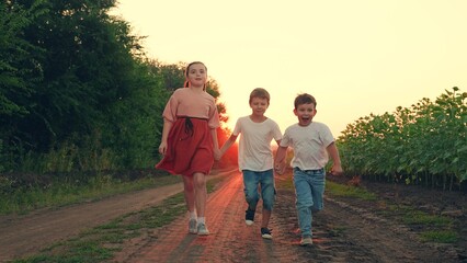 Happy boy, girl running, playing together in nature. Family, children travel in nature. Kids play,...