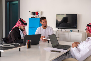Arab males in meeting during work with copy space