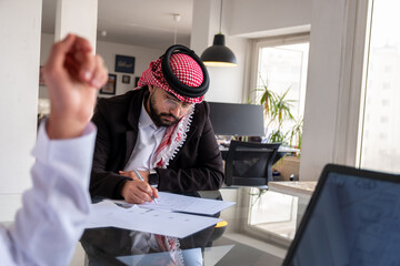 portrait for young arab male working in modern office with smile on his face