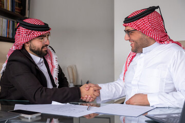 Agreement between two arabian men while shaking hands
