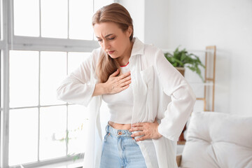 Mature woman experiencing menopause at home