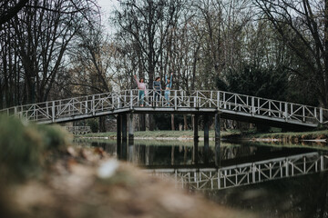 Determined female runners stretching on a wooden bridge surrounded by nature before a workout session.