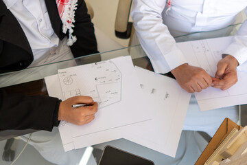 arabian males working on designs for buildings