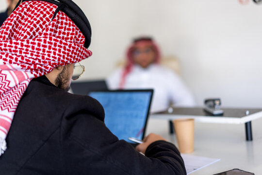 arab using laptop during work in office on meeting table to finish the project