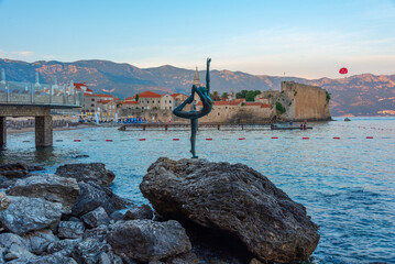 Dancing girl and the old town of Budva, Montenegro © dudlajzov