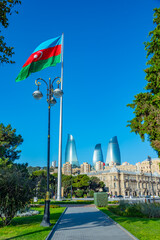 Flagpole with flag of Azerbaijan at seaside promenade in Baku