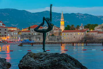 Dancing girl and the old town of Budva, Montenegro © dudlajzov