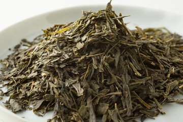 A closeup view of a pile of loose leaf bancha green tea.