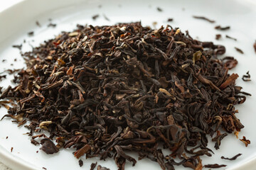 A closeup view of a pile of loose leaf Sungma black tea.