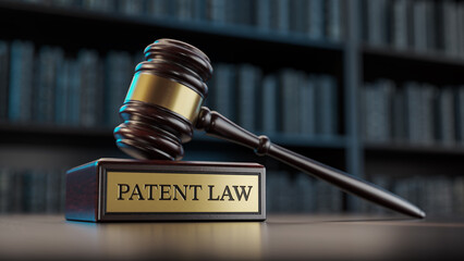 Patent Law: Judge's Gavel as a symbol of legal system and wooden stand with text word - 779320628