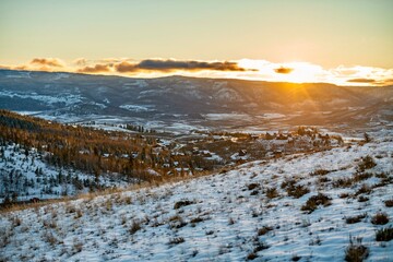 Sunset over the village in Colorado Rocky Mountains, winter snow