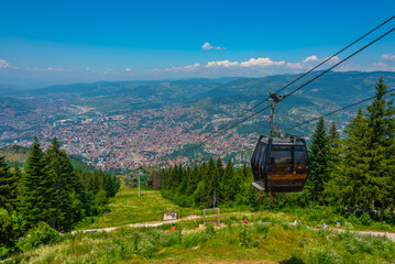 Trebevic gondola raising from the old town of Sarajevo, Bosnia and Herzegovina