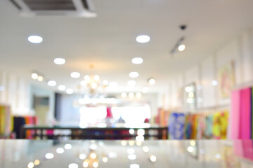 Abstract blur and defocused clothing department store in shopping mall interior for background.