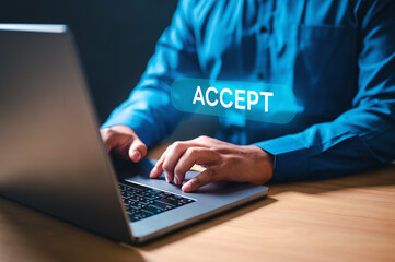 accept, approve, job, keyboard, working, information, search, corporate, network, office. A man is typing on a laptop with the word accept on the screen. Concept of urgency and importance.