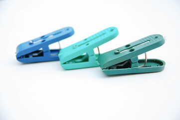 Plastic clothespin isolated on a white background. Selective focus. Copy space.