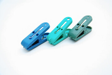 Plastic clothespin isolated on a white background. Selective focus. Copy space.