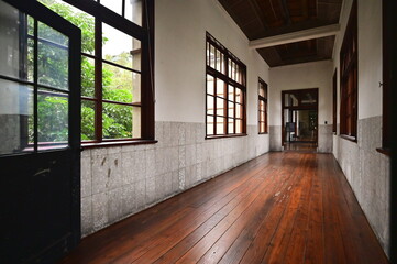 Taiwan - Jan 24, 2024: The wooden floor corridors of Songshan Cultural and Creative Park integrate historical charm with modern design, showcasing diverse and captivating architecture.