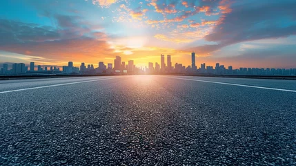 Tableaux ronds sur plexiglas Skyline Empty asphalt road and city skyline with blue sky at sunset background, panoramic view of urban architecture and bridge