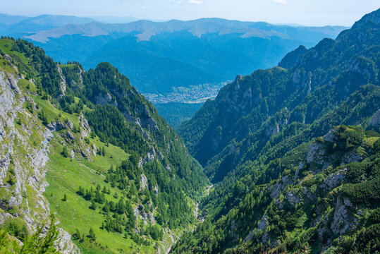 Summer day at Caraiman valley leading to Bucegi mountains near Busteni village in Romania