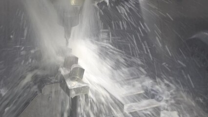 The 5-axis CNC milling machine  cutting the water turbine parts with water base coolant method.