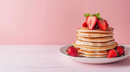 Plexiglas foto achterwand A stack of pancakes topped with ripe strawberries on pink background, ready to be enjoyed © tashechka
