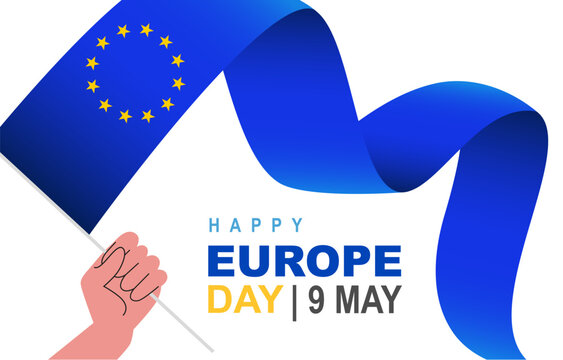 A human hand holds the waving flag of Europe. 12 five-pointed yellow stars. 9th May. Happy Europe Day.