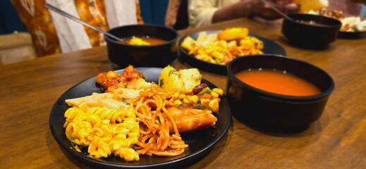 Close up shot of Restaurant food with soup bowl. Noodles and pasta dish with soup in restaurant. 