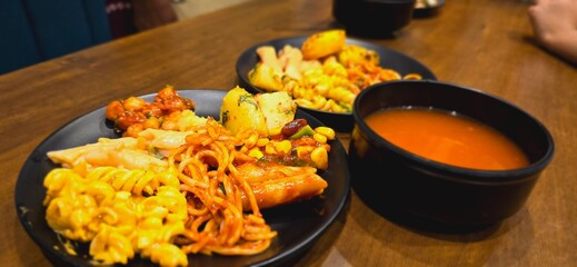 Close up shot of Restaurant food with soup bowl. Noodles and pasta dish with soup in restaurant. 