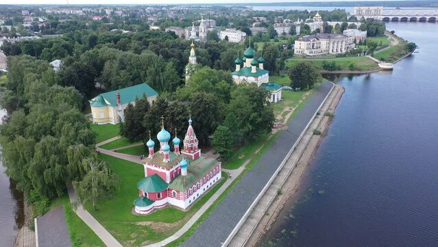 Picturesque aerial view of modern townscape of Uglich overlooking dam on Volga River on summer day, Yaroslavl region, Russia. High quality 4k footage