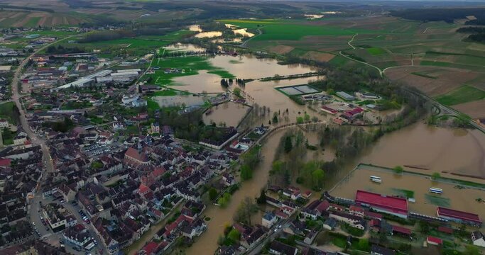 Aerial view of the floods in the France. Yonne river in flood. Natural disaster. Water flooded a city in french department. Chablis town flooded. Spring flood in France