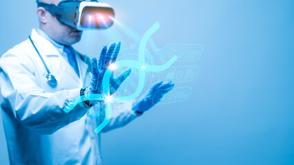 A doctor wearing a white lab coat is using a virtual reality headset to view a 3D image of a cell,...