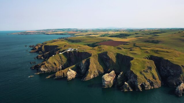 Scotland&rsquo;s Rocky Coastal Elegance: Aerial Views of St Abbs Head Cliff and Nature Reserve, Scottish Landmark.