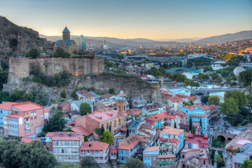 Sunset view of Narikala fortress overlooking downtown Tbilisi in Georgia © dudlajzov