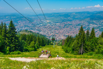 Trebevic gondola raising from the old town of Sarajevo, Bosnia and Herzegovina