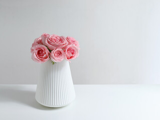 Pink roses for Valentine's Day on a white table top