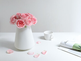Pink roses for Valentine's Day on a white table top