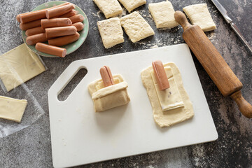 Cooking Easter rabbit-shaped buns puff pastry from sausage and cheese, step by step, step 2. - 779401824