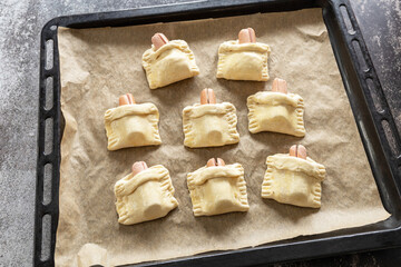 Cooking Easter rabbit-shaped buns puff pastry from sausage and cheese, step by step, step 5. - 779401882