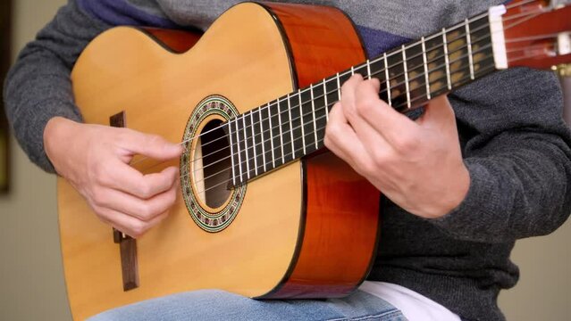 Close-up shot of a man playing the bossa nova rhythm