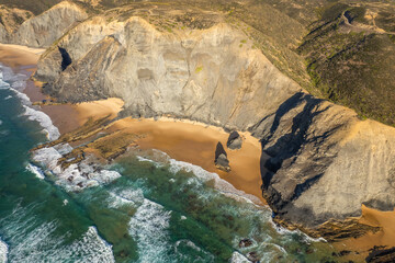 Aerial droe view of beautiful natural Cordoama beach in Portugal Atlantic coast - 779408096