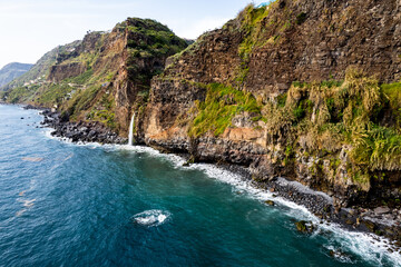 Waterfall fall into Atlantic Ocean in Madeira Island, Portugal. Aerial Drone view - 779410628