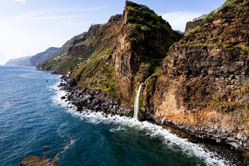 Waterfall fall into Atlantic Ocean in Madeira Island, Portugal. Aerial Drone view - 779410699