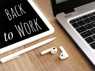Back to work background with text, laptop and earbuds. Welcome back to the Office poster