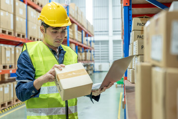 Warehouse worker pick box goods in inventory and check stock product. Transport logistic business...