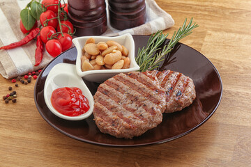 Grilled beef burger cutlet with sauce