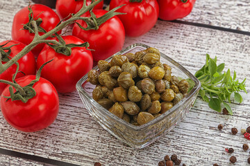 Marinated green capers in the bowl