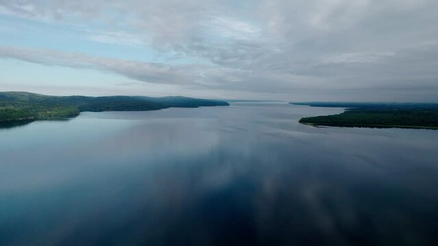 "Capture the breathtaking beauty of Lake Baikal and the Angara River from above in stunning aerial footage. Ships and boats glide through the crystal-clear waters, offering fantastic views.